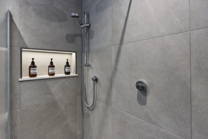Tiled Shower with Shelf Space Integrated into the Wall