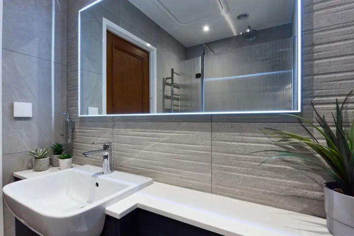 Large Light Edged Mirror Over Textured Tiles