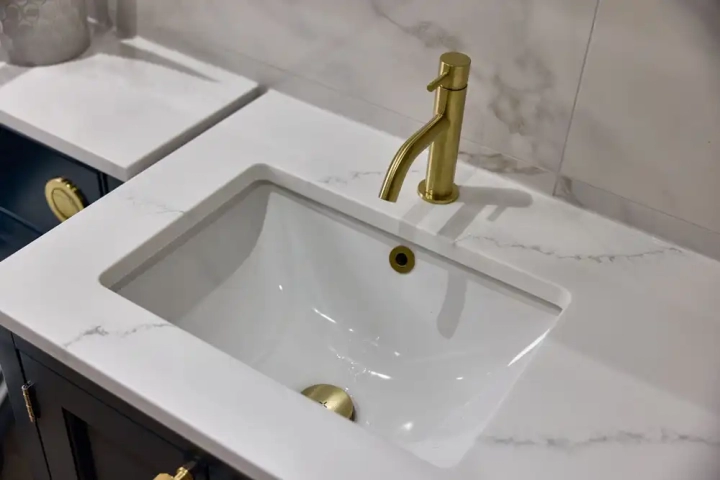 Sink With Marble Counter and Tiles